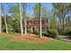 Inviting brick home with manicured landscaping and mature trees in a quiet neighborhood at 3141 Branford Ct, Marietta, GA 30062