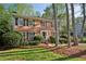 Charming two-story brick home with black shutters and a well-manicured lawn at 3141 Branford Ct, Marietta, GA 30062