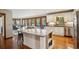 Modern kitchen with granite countertops, stainless steel appliances, and an open dining area at 3141 Branford Ct, Marietta, GA 30062