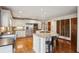 Open kitchen with a large island, stainless steel appliances, granite countertops, and hardwood floors at 3141 Branford Ct, Marietta, GA 30062