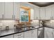 Bright kitchen featuring stainless steel appliances, stone countertops, under cabinet lights, and ample storage at 3141 Branford Ct, Marietta, GA 30062