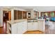 Open-concept kitchen featuring a granite island with a cooktop and modern cabinets at 3141 Branford Ct, Marietta, GA 30062