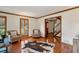 Cozy living room with hardwood floors, wood trim, and lots of natural light at 3141 Branford Ct, Marietta, GA 30062