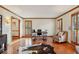 Home office with hardwood floors, wood trim, shutters, and plenty of natural light at 3141 Branford Ct, Marietta, GA 30062