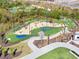 Aerial view of the community's mini golf course with putting greens, sand traps, water features and an airstream at 3315 Hillshire Dr, Cumming, GA 30028