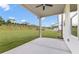 Covered patio overlooking a large backyard with a grassy slope at 3315 Hillshire Dr, Cumming, GA 30028