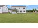 Expansive backyard showcasing the rear elevation of the two-story home at 3315 Hillshire Dr, Cumming, GA 30028