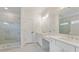 Modern bathroom with double vanity, luxurious walk-in shower, and marble tile accents at 3315 Hillshire Dr, Cumming, GA 30028