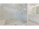 Modern bathroom featuring a glass shower with marble-patterned tile and a white vanity at 3315 Hillshire Dr, Cumming, GA 30028