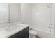 Modern bathroom features a white vanity, subway tile, and a shower-tub combination at 3315 Hillshire Dr, Cumming, GA 30028