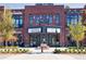 Charming brick building exterior features a marquee and storefronts in a historic city center at 3315 Hillshire Dr, Cumming, GA 30028