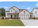 Charming two-story home with a manicured lawn, attached garage, and classic neutral color palette at 3315 Hillshire Dr, Cumming, GA 30028
