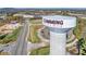 View of Cumming Home water tower with roads and light industrial area in the background at 3315 Hillshire Dr, Cumming, GA 30028
