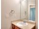 Bathroom features a vanity with a sink, mirror, and neutral walls at 3320 Gardenside Dr, Loganville, GA 30052
