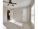 Bright bedroom with ceiling fan and neutral carpet at 3320 Gardenside Dr, Loganville, GA 30052