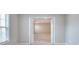 Bedroom with a window and double door opening into another room at 3320 Gardenside Dr, Loganville, GA 30052