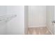 Bright closet space with carpeted flooring and a white wire rack for optimal storage at 3320 Gardenside Dr, Loganville, GA 30052