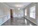 Elegant dining room with hardwood floors, crown molding, and natural light creating a perfect ambiance at 3320 Gardenside Dr, Loganville, GA 30052