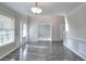 Open-concept dining room with hardwood floors, crown molding, and lots of natural light at 3320 Gardenside Dr, Loganville, GA 30052
