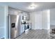 Kitchen features stainless steel appliances, granite counters, and neutral cabinets at 3320 Gardenside Dr, Loganville, GA 30052