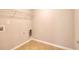 Bright laundry room with tile floors, shelving and hookups for a washer and dryer at 3320 Gardenside Dr, Loganville, GA 30052