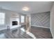 Spacious living room features a fireplace, hardwood floors, and neutral paint at 3320 Gardenside Dr, Loganville, GA 30052