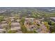 A high aerial shot showcases a residential area with brick buildings and lush greenery at 113 Brittany Ct, Duluth, GA 30096