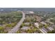 Overhead shot features a neighborhood near a busy highway, surrounded by mature trees and greenery at 113 Brittany Ct, Duluth, GA 30096