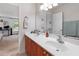 Bathroom with a double sink vanity and a view of the bedroom at 113 Brittany Ct, Duluth, GA 30096