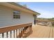 Inviting back deck area with wood railings, a perfect spot for outdoor relaxation and entertaining with backyard views at 209 Emma Gilley Dr, Carrollton, GA 30116