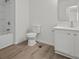 Well-lit bathroom with a bathtub and a white vanity at 209 Emma Gilley Dr, Carrollton, GA 30116