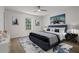 Well appointed primary bedroom boasts a plush blue bed and modern artwork at 209 Emma Gilley Dr, Carrollton, GA 30116