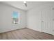 A simple, clean bedroom with a ceiling fan and a bright window at 209 Emma Gilley Dr, Carrollton, GA 30116