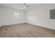 A bright bedroom featuring modern flooring and a ceiling fan at 209 Emma Gilley Dr, Carrollton, GA 30116