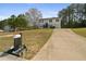 Charming split-level home with a mailbox and driveway in a serene neighborhood at 209 Emma Gilley Dr, Carrollton, GA 30116
