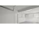 Bright garage featuring overhead storage cabinets and a clean, organized layout for functionality at 209 Emma Gilley Dr, Carrollton, GA 30116