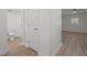 Hallway and bathroom with modern wood flooring at 209 Emma Gilley Dr, Carrollton, GA 30116