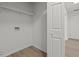 Well-lit laundry room with storage shelf and hookups, blending functionality with a modern aesthetic at 209 Emma Gilley Dr, Carrollton, GA 30116
