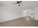 Empty living room with hardwood floors that opens to a kitchen at 209 Emma Gilley Dr, Carrollton, GA 30116