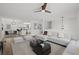 Open-concept living room with modern furnishings and a clear view of the adjacent kitchen at 209 Emma Gilley Dr, Carrollton, GA 30116