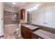 Bathroom features granite countertops, dual vanity, shower and soaking tub at 3635 E Paces Ne Cir # 1209, Atlanta, GA 30326
