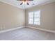 Cozy bedroom with plush carpeting, ceiling fan, and window at 3635 E Paces Ne Cir # 1209, Atlanta, GA 30326