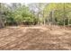 Dog park with mulch ground cover, benches, and mature trees at 3635 E Paces Ne Cir # 1209, Atlanta, GA 30326