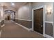 View of the condo hallway with neutral tones and decorative trim at 3635 E Paces Ne Cir # 1209, Atlanta, GA 30326