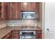 Gourmet kitchen features stainless steel appliances, granite countertops, and custom cabinetry at 3635 E Paces Ne Cir # 1209, Atlanta, GA 30326