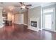 Open concept living room and kitchen layout with hardwood floors and fireplace and adjacent entrance at 3635 E Paces Ne Cir # 1209, Atlanta, GA 30326