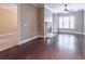 Spacious living room featuring hardwood floors, a cozy fireplace, and a bright sunny window at 3635 E Paces Ne Cir # 1209, Atlanta, GA 30326