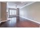 Spacious living room with hardwood floors, a fireplace, and natural light at 3635 E Paces Ne Cir # 1209, Atlanta, GA 30326