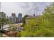 View from condo overlooking a street with mature trees and other condo buildings in the neighborhood at 3635 E Paces Ne Cir # 1209, Atlanta, GA 30326