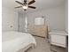 Cozy bedroom featuring a large dresser, workspace, and a ceiling fan for added comfort at 5925 Pine Bluff Dr, Cumming, GA 30040